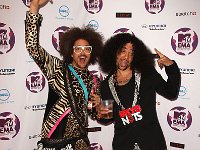 LMFAO  Posed shot of LMFAO. SkyBlu is wearing a mismatched pair of black and white high top chucks.